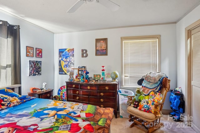 bedroom with ceiling fan, carpet floors, and crown molding