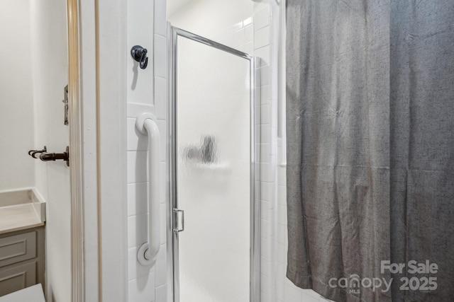 bathroom featuring a shower stall