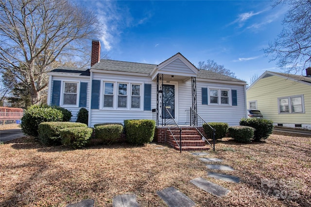 view of front of home featuring a chimney