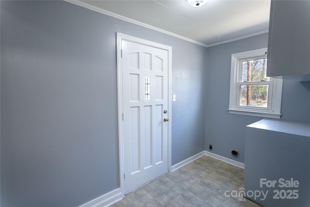 laundry area with baseboards, laundry area, electric dryer hookup, and crown molding