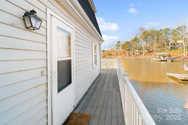 wooden deck with a water view