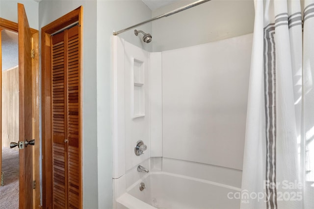 full bath with a closet and shower / tub combo with curtain