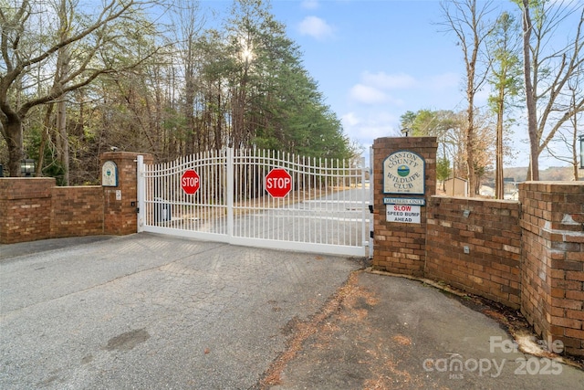 view of gate with fence