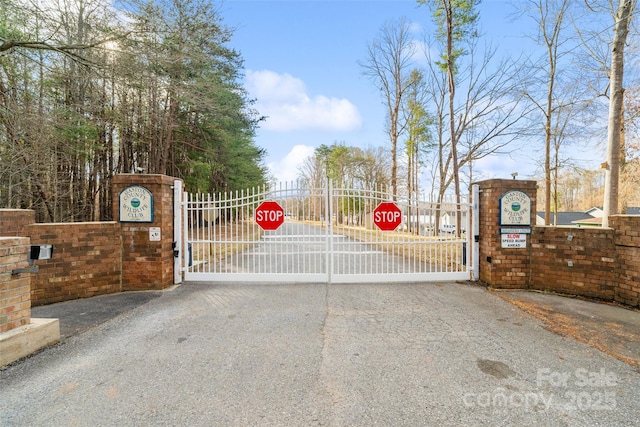 view of gate featuring fence