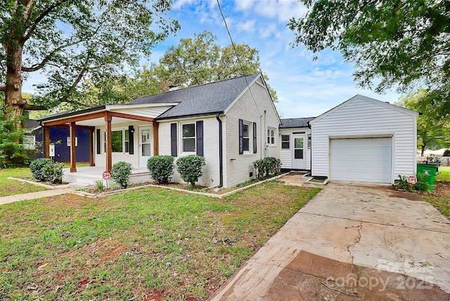 ranch-style house with a porch, an attached garage, brick siding, driveway, and a front yard