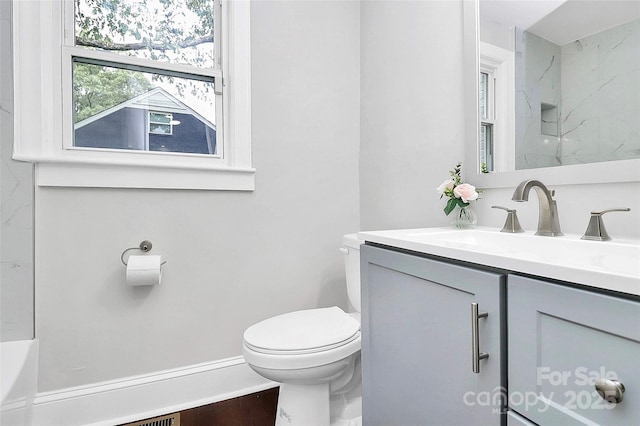 full bath with vanity and toilet