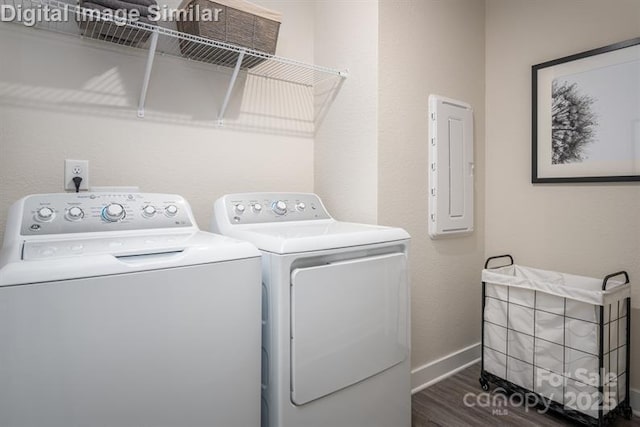 1626 Respect St NW, Concord, NC 28027 - washroom with independent washer and dryer, electric panel, and wood finished floors