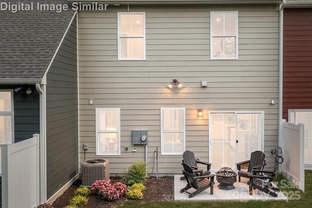 1626 Respect St NW, Concord, NC 28027 - back of house with a fire pit, a patio, and roof with shingles
