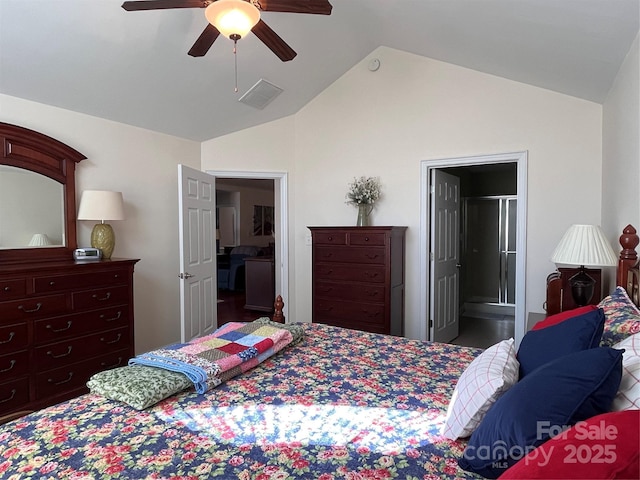 bedroom with ceiling fan, visible vents, vaulted ceiling, and ensuite bathroom