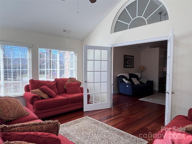 living room with high vaulted ceiling, wood finished floors, visible vents, a ceiling fan, and french doors