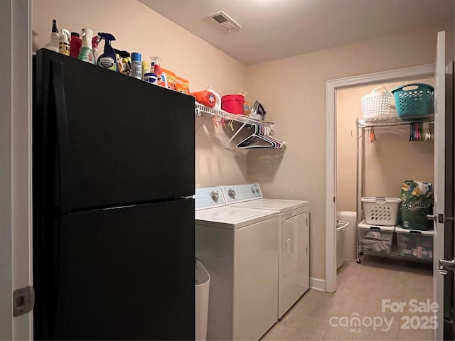 clothes washing area with laundry area, independent washer and dryer, and visible vents