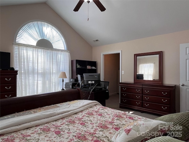 carpeted bedroom featuring lofted ceiling, ceiling fan, and visible vents