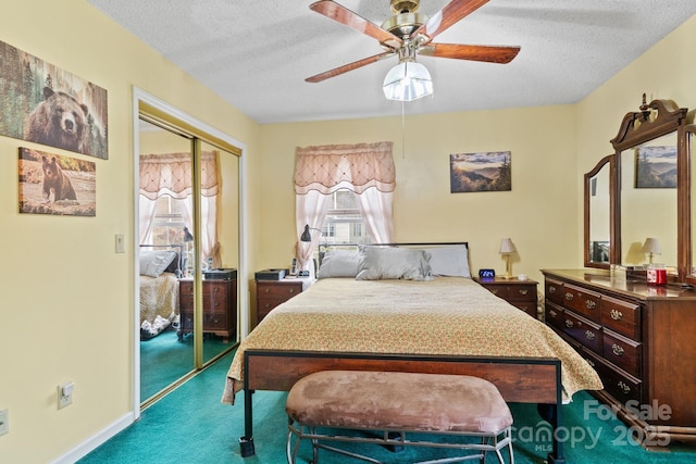 bedroom featuring a textured ceiling, ceiling fan, a closet, and carpet flooring