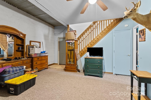 bedroom featuring concrete block wall and light colored carpet