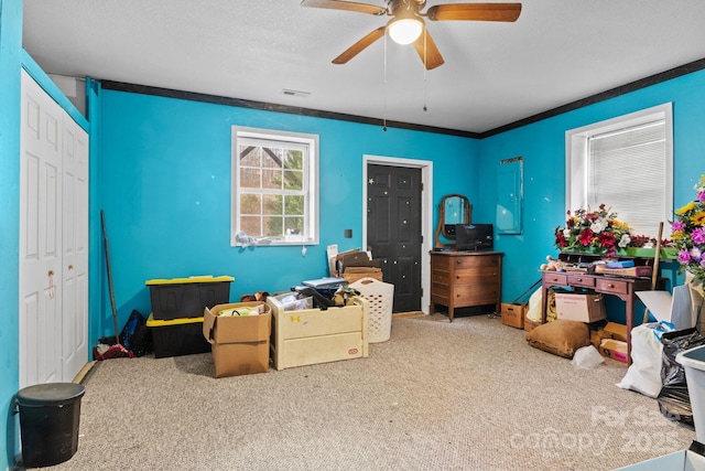 interior space featuring ceiling fan, a textured ceiling, visible vents, and a closet