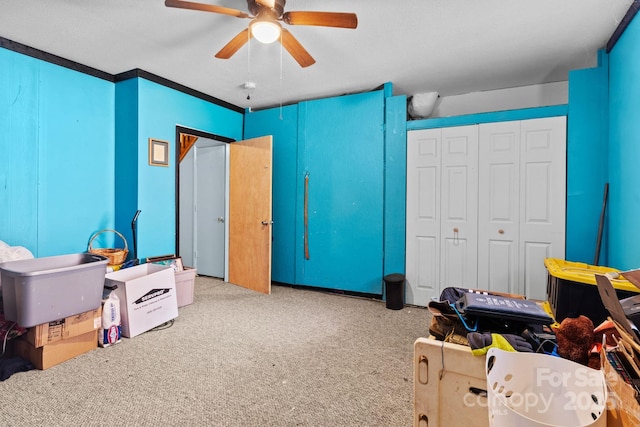 recreation room featuring a ceiling fan and carpet