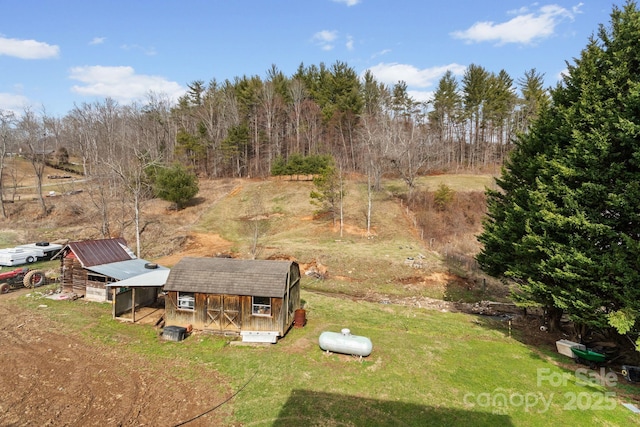 birds eye view of property with a rural view