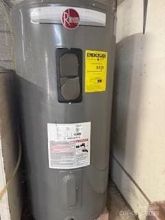 utility room featuring electric water heater