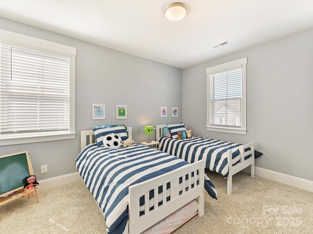 bedroom with baseboards, visible vents, and carpet flooring