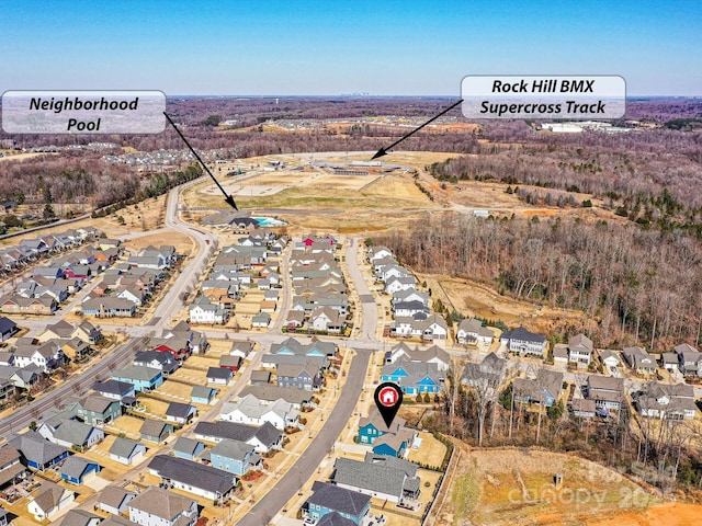 birds eye view of property with a residential view