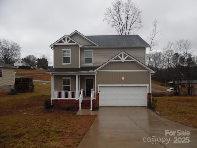 craftsman-style home with covered porch, concrete driveway, brick siding, and central air condition unit