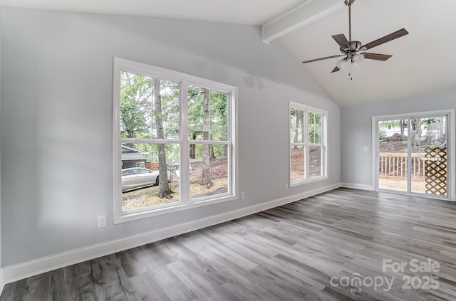 spare room featuring lofted ceiling with beams, ceiling fan, light wood-style flooring, and baseboards