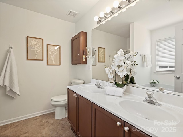 bathroom featuring double vanity, toilet, visible vents, and a sink