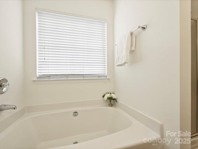 bathroom featuring a garden tub