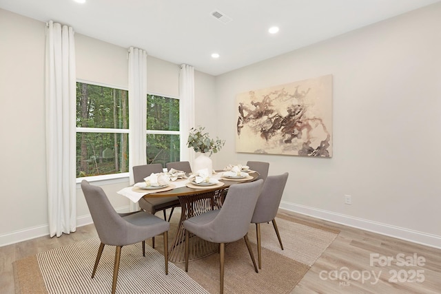 dining area with recessed lighting, light wood-type flooring, visible vents, and baseboards