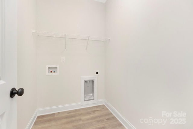 laundry room featuring hookup for an electric dryer, laundry area, washer hookup, baseboards, and light wood-style floors