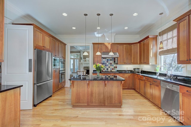 kitchen featuring stainless steel appliances, a center island, light wood finished floors, and ventilation hood