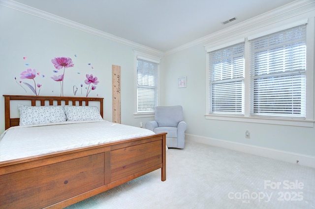 bedroom with ornamental molding, visible vents, light carpet, and baseboards