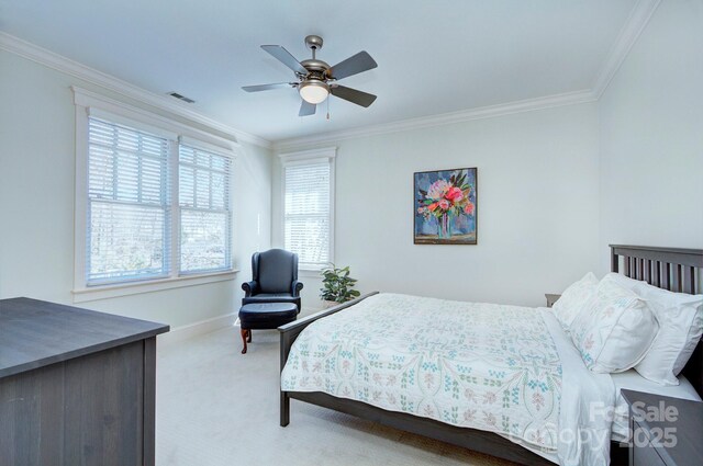 bedroom featuring baseboards, carpet, visible vents, and crown molding