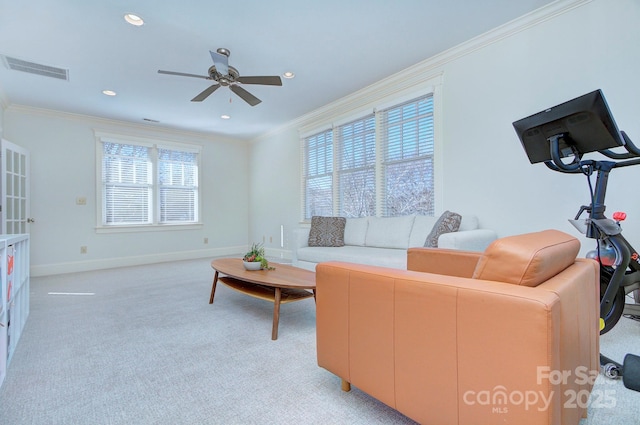 living room featuring light carpet, baseboards, visible vents, and crown molding