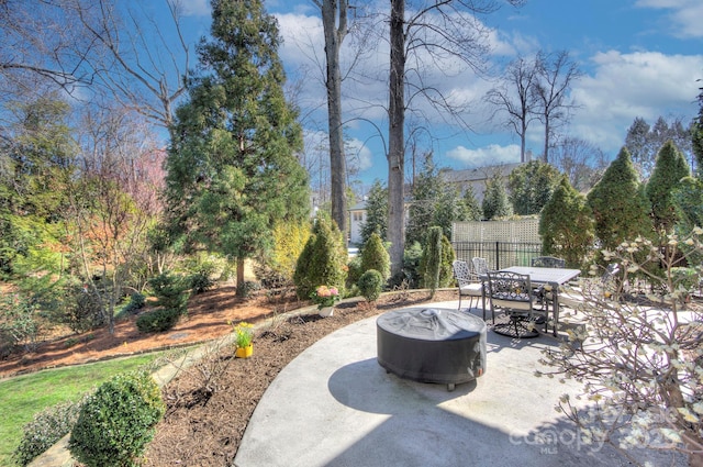 view of patio / terrace featuring fence and outdoor dining area