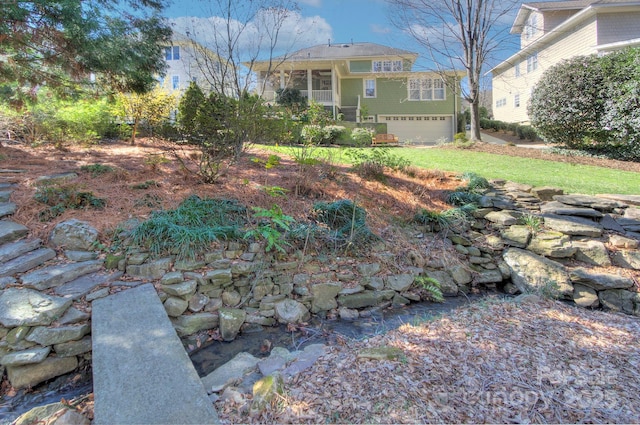 view of yard featuring an attached garage