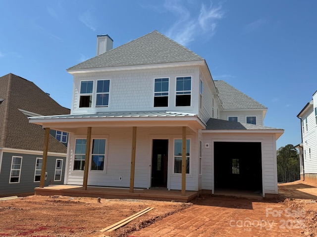 7459 Fighting Creek Rd Unit 33, Sherrills Ford, NC 28673 - view of front of property featuring roof with shingles, a standing seam roof, a chimney, metal roof, and covered porch