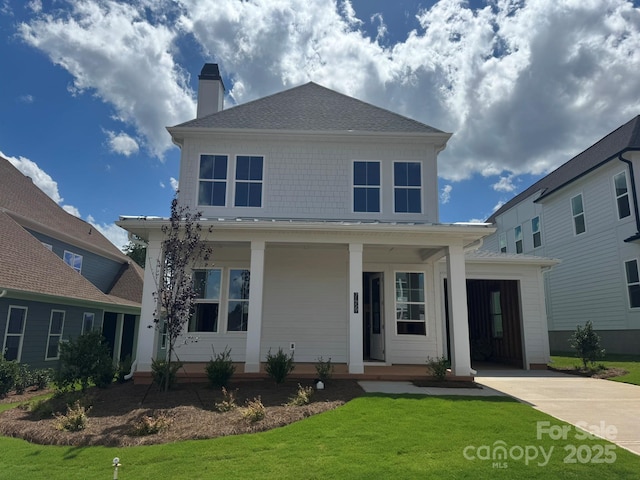 7459 Fighting Creek Rd Unit 33, Sherrills Ford, NC 28673 - view of front of house with covered porch, a front yard, a chimney, and driveway