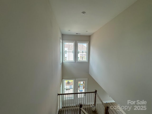 7459 Fighting Creek Rd Unit 33, Sherrills Ford, NC 28673 - stairs with healthy amount of natural light and wood finished floors