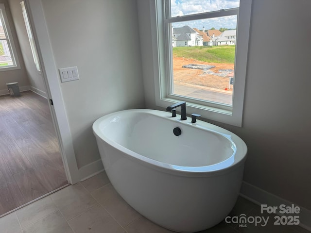 7459 Fighting Creek Rd Unit 33, Sherrills Ford, NC 28673 - bathroom with a freestanding tub and baseboards