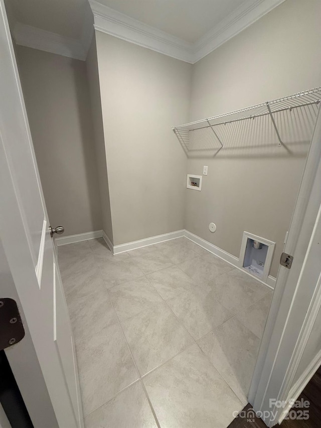 clothes washing area featuring crown molding, hookup for a washing machine, hookup for a gas dryer, laundry area, and baseboards