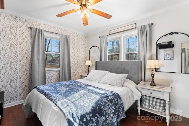 bedroom with ornamental molding, multiple windows, and wallpapered walls