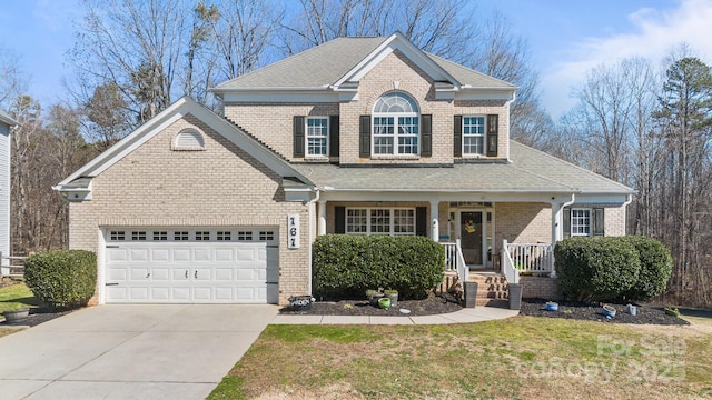 view of front of property with brick siding, roof with shingles, concrete driveway, a garage, and a front lawn