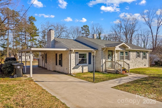 ranch-style home featuring an attached carport, brick siding, driveway, a front lawn, and a chimney