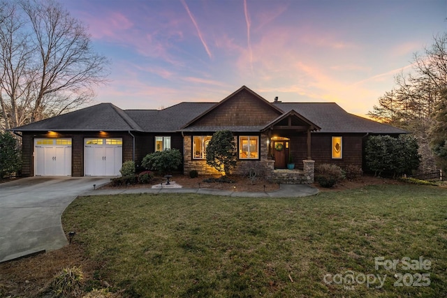 craftsman inspired home with a garage, stone siding, driveway, and a front lawn