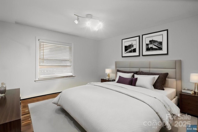 bedroom featuring wood finished floors