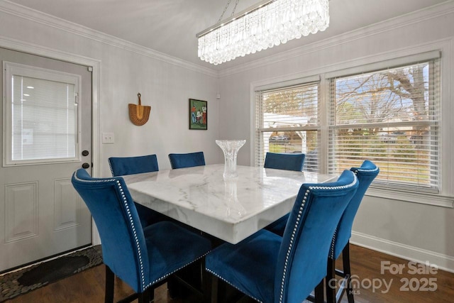 dining space with baseboards, a chandelier, dark wood-type flooring, and ornamental molding