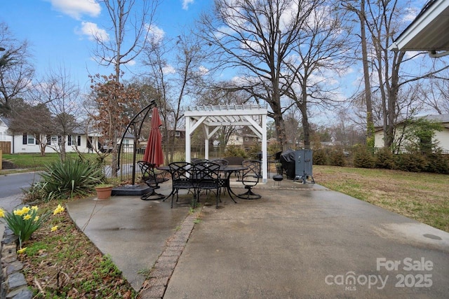 view of patio featuring fence, grilling area, and a pergola