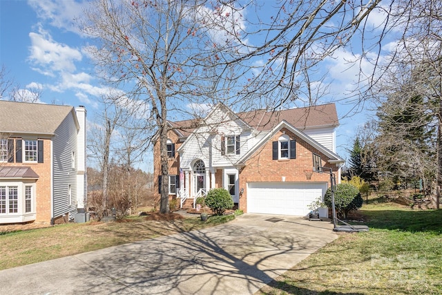 traditional-style house featuring a garage, driveway, brick siding, and a front lawn