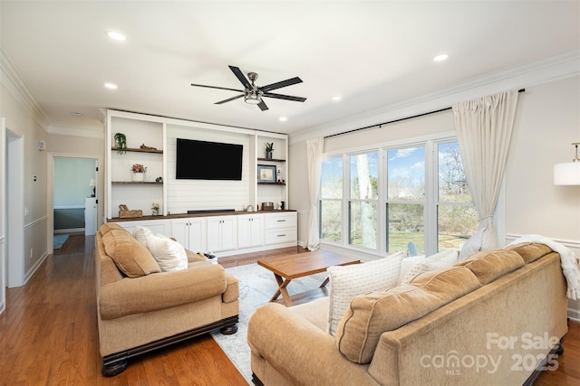 living area featuring ornamental molding, recessed lighting, ceiling fan, and wood finished floors